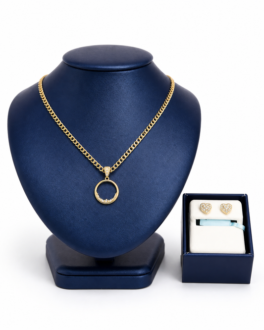 Two-tone Cuban, circular medal with cubic zirconia design and a pair of heart-shaped diamond earrings.